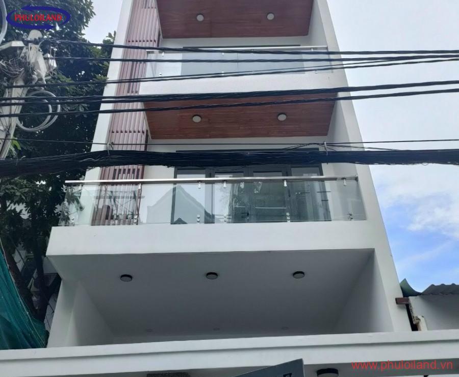 mat truoc toa nha ban 900x738 - Bán tòa nhà phố có hầm và thang máy, mặt tiền đường số 25A, phường Tân Quy, Quận 7