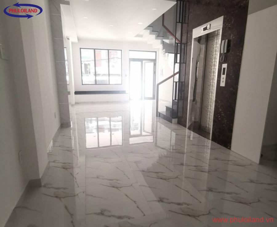 sanh cho thang may va tang tret 900x738 - Bán tòa nhà phố có hầm và thang máy, mặt tiền đường số 25A, phường Tân Quy, Quận 7